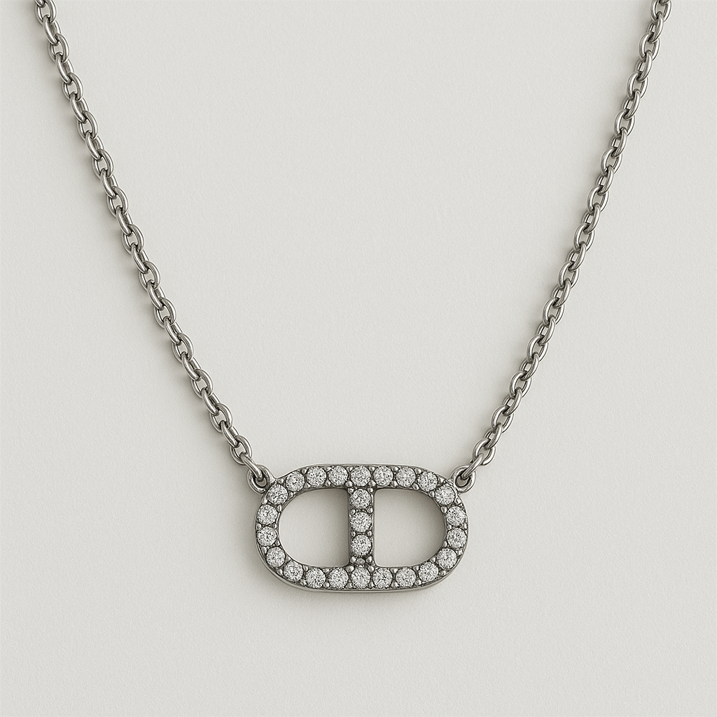Collier Ovalia Cristal en acier inoxydable argenté avec pendentif ovale pavé de zircons, bijou élégant et raffiné, hypoallergénique et résistant à l'eau.