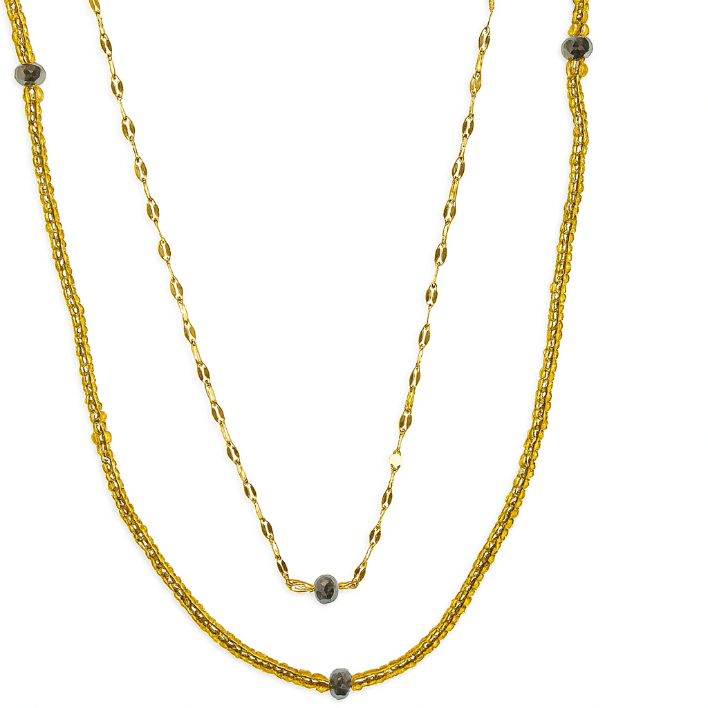 Collier Doré Eclipse à double rang avec perles d’hématite, bijou doré élégant et raffiné pour femme.