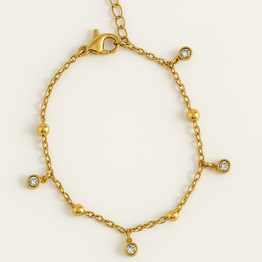 Bracelet pampilles dorées et zirconium en acier inoxydable doré, bijou raffiné et élégant, résistant à l'eau et hypoallergénique.