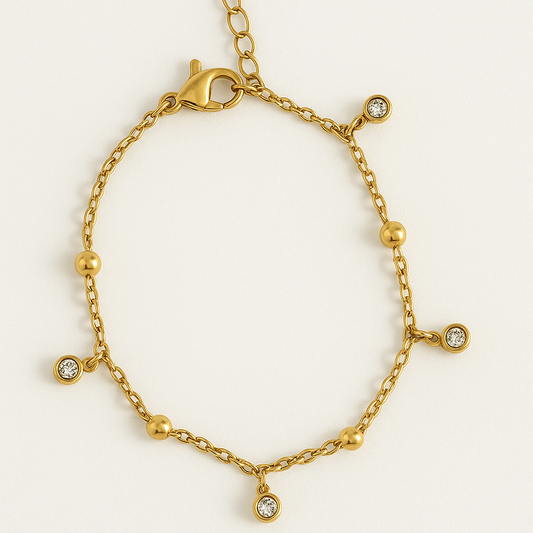 Bracelet pampilles dorées et zirconium en acier inoxydable doré, bijou raffiné et élégant, résistant à l'eau et hypoallergénique.